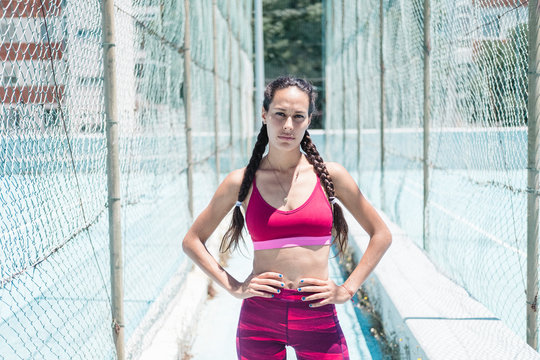 Colorful image of upper body of female athlete posing on court