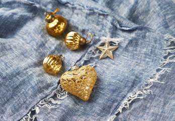 Christmas golden baubles on blue background. Copy space. 