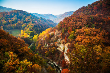 Autumn sunrise on mountain with fog between the hills. National park Djerdap in Serbia.