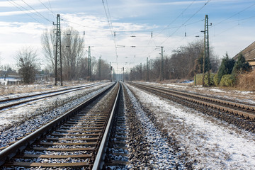 Fototapeta na wymiar Railway tracks on winter day. Industrial landscape
