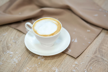 Cup of fresh boiled coffee in cafe with christmas decoration