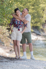 couple on country walk through woodland