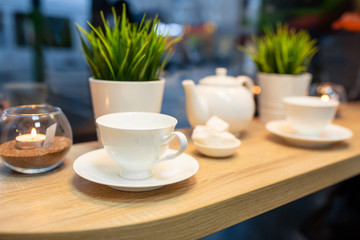Cup of fresh boiled coffee in cafe with christmas decoration