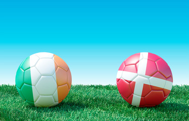 Two soccer balls in flags colors on green grass. Ireland and Denmark. EURO 2020. Group D. 3d image