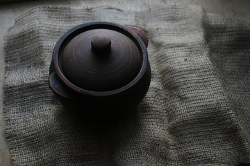 Clay pot on a gloomy background