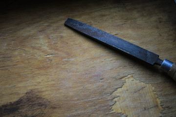 Old tools on a wooden board