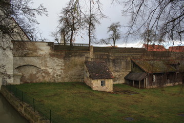 Old house nearby wall