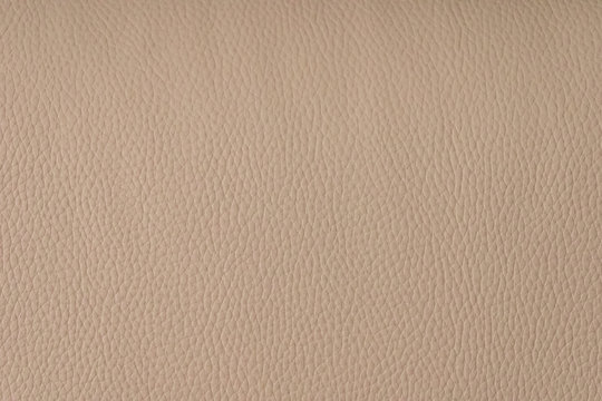 Beige leather texture background. Blank space. Colorful texture.