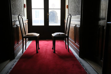 Old very nice and stylish armchair standing in the window