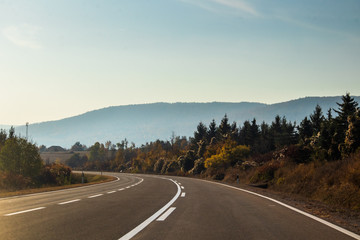 Sunrise on mountain road at autumn. Road by the Rtanj mountain in Serbia.