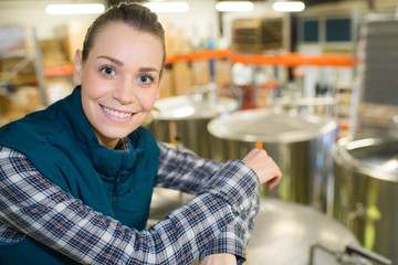 beautiful young engineer in a factory