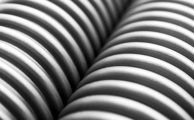 Abstract background of corrugated plastic tubes. Close up.