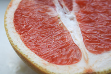 Sliced grapefruits on a stone table