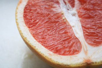 Sliced grapefruits on a stone table