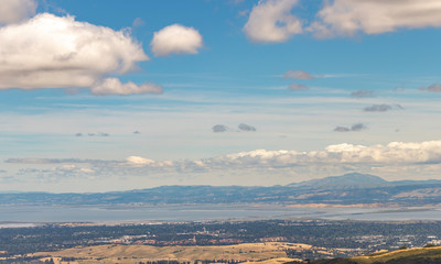 View Palo Alto and the San Francisco Bay including the Dumbarton Bridge, Stanford University, and the mountains of the East Bay.