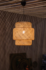 modern wicker lamp chandelier, lampshade design light. Local shaped lamps on ceiling on dark background
