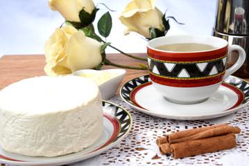 cup of tea with cheese on wooden table, brazilian breakfast