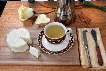 cup of tea with cheese on wooden table, brazilian breakfast