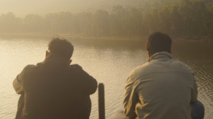 young mans at sunset