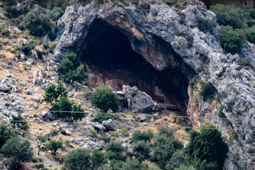 Naklejka premium Caves in the limestone mountains. Void in rock mountain.