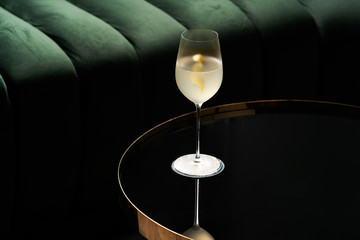 Fresh cocktail glass on glass table in night club restaurant