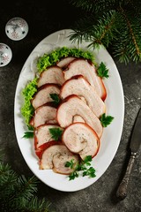 Boiled pork belly roll in onion peel with bay leaf.