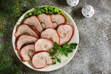 Boiled pork belly roll in onion peel with bay leaf.