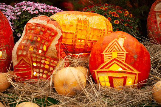 pumpkins in honor of the celebration of autumn and Halloween. festival of vegetables. creative house of pumpkin