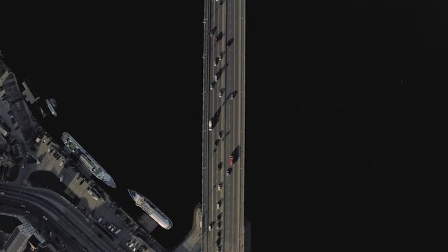 The bridge over the Dnieper river in Kiev city. Drone 4K fligt in sunny spring day
