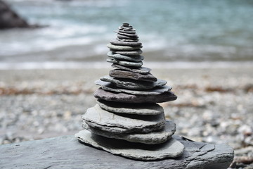 Stacked rocks in a Zen balancing style on a Cornish beach