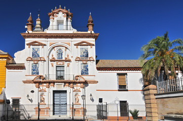Fototapeta na wymiar Spain, Andalusia, Sevilla, church of the Hospital de la Caridad (Charity Hospital), facade with azulejos.