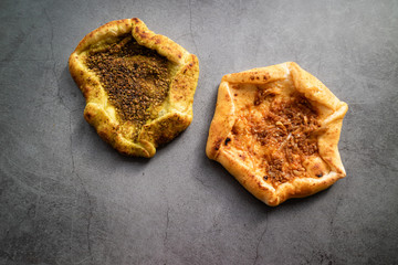 Red and green Jerusalem bread on concrete background. Israeli cuisine. Top view