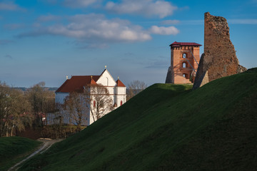 Fototapeta premium Ruins of Towers of Mindovg Castle and Farnese Church of Transfiguration of the Lord in Novogrudok, Belarus.