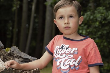 portrait of a boy in a forest 