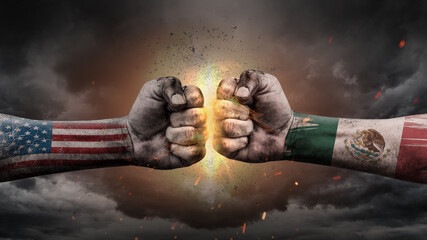 USA vs Mexico. Fists with flags. Battle of two countries on sky.