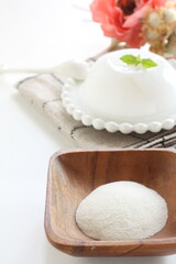 White agar powder on wooden plate for cooking image