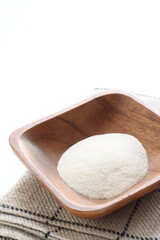 White agar powder on wooden plate for cooking image