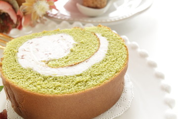gourmet dessert, green tea Swiss roll on dish