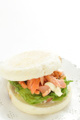 Homemade grilled salmon flake and mayonnaise in English muffin sandwich