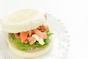 Homemade grilled salmon flake and mayonnaise in English muffin sandwich
