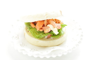 Homemade grilled salmon flake and mayonnaise in English muffin sandwich