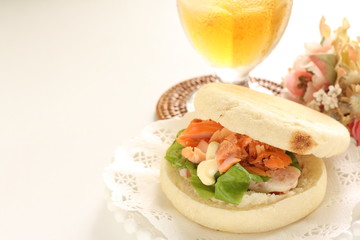Homemade grilled salmon flake and mayonnaise in English muffin sandwich