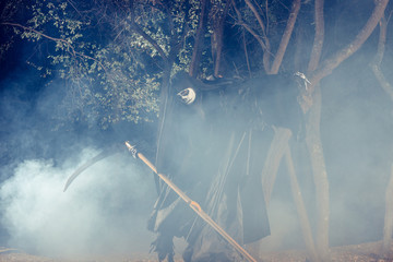 Portrait of grim reaper, the angel of death ( Azrael ) lurking through the woods at night...