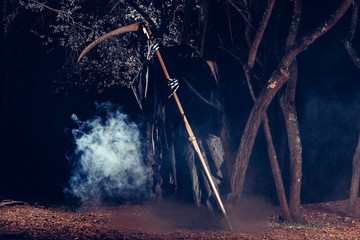 Portrait of grim reaper, the angel of death ( Azrael ) lurking through the woods at night...