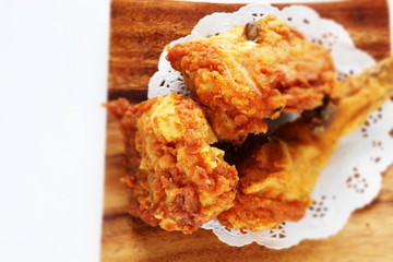 Fried chicken on wooden plate