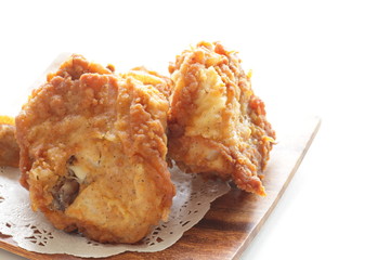 Fried chicken on wooden plate