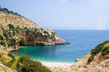 Fototapeta na wymiar Coastal cliffs of limestone. The coast of Mediterranean Sea in Turkey.