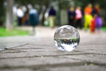 sphere on the side walk, a day in the park