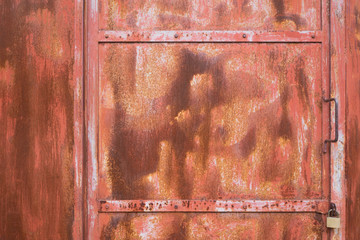 A detail of an aged metal door