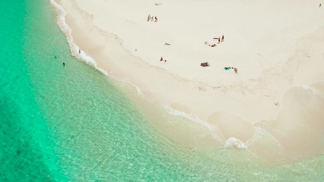 Tropical island with beautiful beach, and turquoise water view from above. Daco island, Philippines. Summer and travel vacation concept